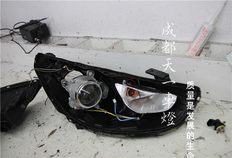 成都現(xiàn)代IX35車燈改裝升級Q5海拉雙光透鏡氙氣燈總成