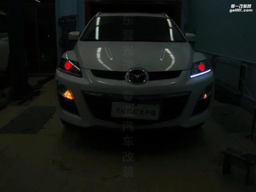 東營(yíng)光速汽車大燈改裝馬自達(dá)CX-7升級(jí)海拉5+惡魔眼